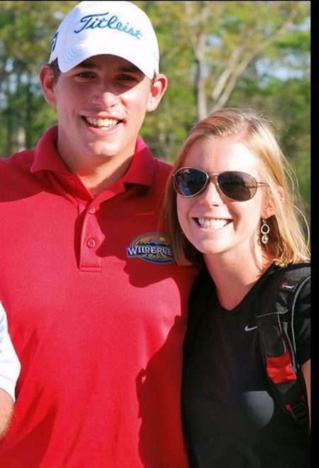 Scott Stallings in red t-shirt poses with his wife Jennifer White.